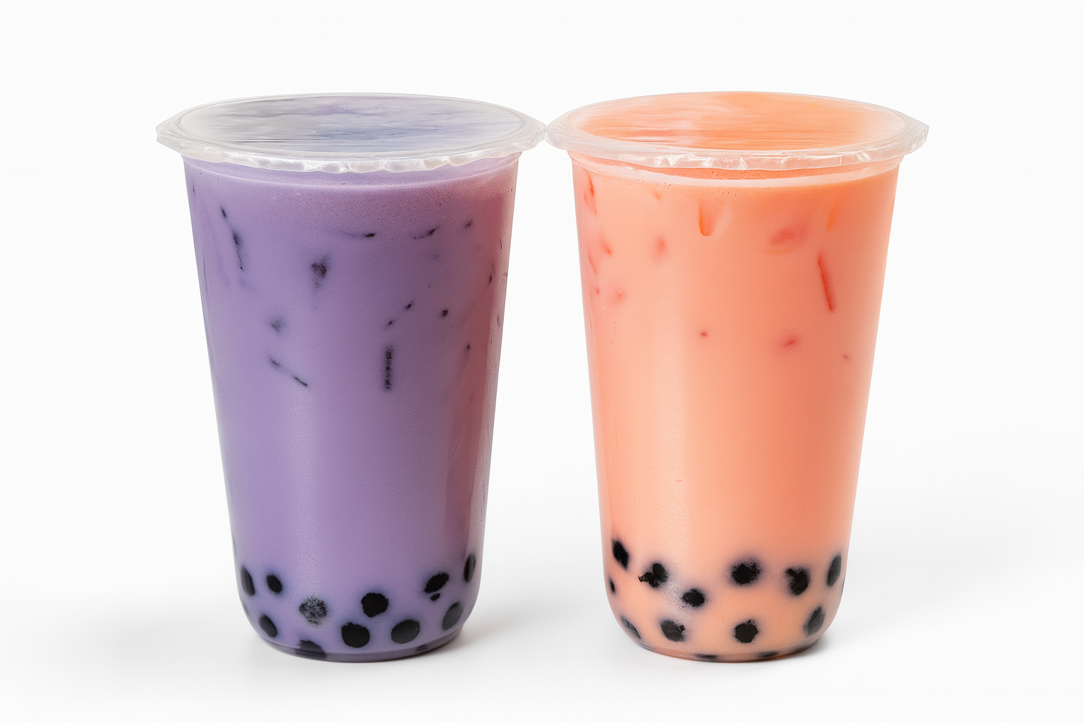 Taro and strawberries milk tea combo Purple and orange boba tea drinks with tapioca pearls, showcasing refreshing flavors ideal for a quick pick-me-up at Farm2Cup Fairhaven.