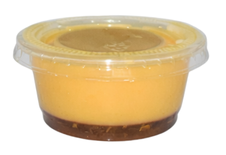 Immunity shot Immunity shot in a clear cup, featuring a vibrant orange layer on top of a dark brown base, emphasizing health benefits and wellness boost.